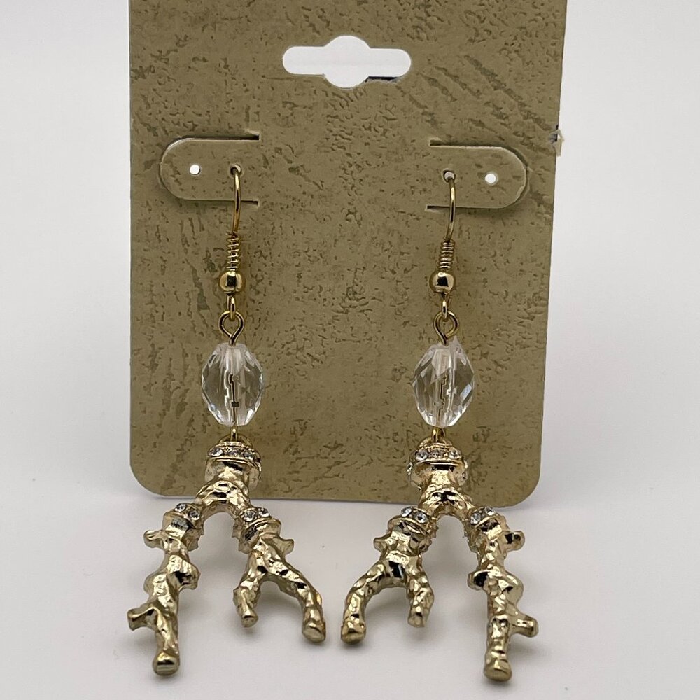 gold-toned earrings with a branch-like design and clear beads.
